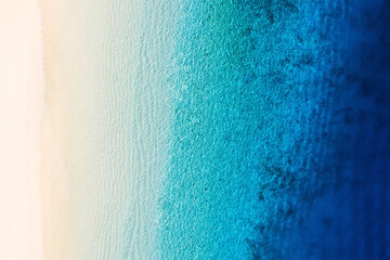 Wall Mural - waves as a background from top view. azure water background from drone. summer seascape from air. gi