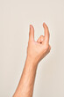 © Krakenimages.com - Hand of caucasian young man showing fingers over isolated white background picking and taking invisible thing, holding object with fingers showing space