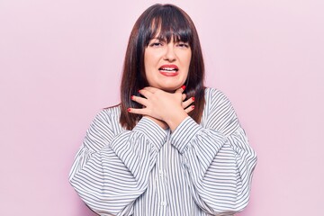 Sticker - Young plus size woman wearing casual clothes shouting and suffocate because painful strangle. health problem. asphyxiate and suicide concept.