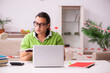 © Elnur - Young male student studying at home in self-isolation concept