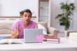 © Elnur - Male student in love preparing for exams at home