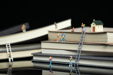 Sticker - Selective focus shot of cute traveler figurines on books