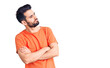 © Krakenimages.com - Young handsome man with beard wearing casual t-shirt looking to the side with arms crossed convinced and confident