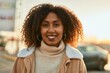 © Krakenimages.com - Young african american woman smiling happy standing at the city.