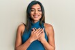 Young latin transsexual transgender woman wearing casual clothes smiling with hands on chest, eyes closed with grateful gesture on face. health concept.