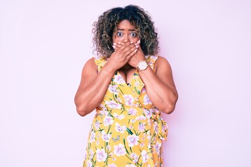 Wall Mural - Young african american plus size woman wearing casual clothes shocked covering mouth with hands for mistake. secret concept.
