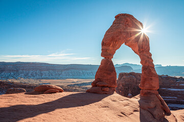 sunbeams on delicate arch, arches national park, utah