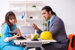 © Elnur - Young businessman and female doctor discussing construction proj
