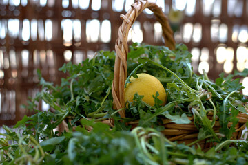 Sticker - Selective focus shot of a heap of Arugula plant and a Trifoliate orange in a basket