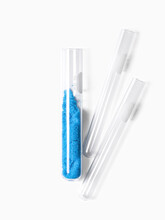 Blue Flake Chemicals In Test Tube, Copper(II) Sulfate. Cosmetic Chemicals Ingredient On Laboratory Table.