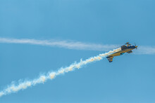 The Aerobatic Plane With Smoke Track In The Sky
