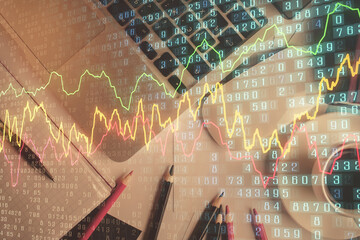 Wall Mural - Double exposure of financial chart drawing over table background with computer. Concept of research and analysis. Top view.