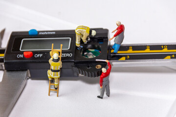 Electronic precision caliber maintenance miniature worker.