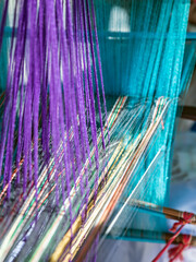 Wall Mural - Loom of weaving Colored threads. India Handloom Board.