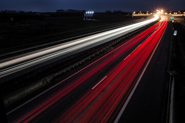 Poster - Long exposure shot of car light streaks on the highway at night