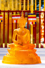 Golden transparent thai buddha statue in the temple