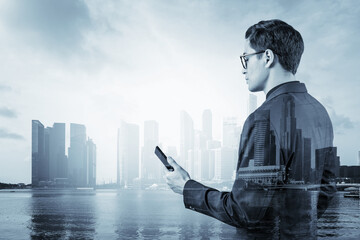 Poster - Young handsome businessman in suit and glasses using phone and thinking how to tackle the problem, new career opportunities, MBA. Singapore on background. Double exposure.