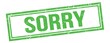 SORRY text on green grungy vintage stamp.