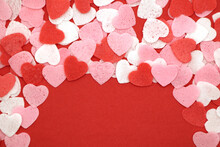 Red Pink And White Hearts On A Red Background. Valentine's Day Concept. Selective Focus. Postcard. Background.