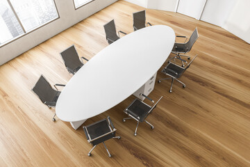 Top view of white and wooden conference room with modern furniture