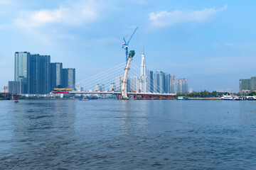 Sticker - Beautiful view of the water and the cityscape with skyscrapers and the bridge on a sunny day