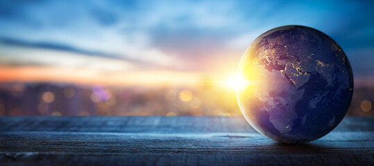 Wall Mural - planet earth on the background of blurred lights of the city. concept on business, politics, ecology