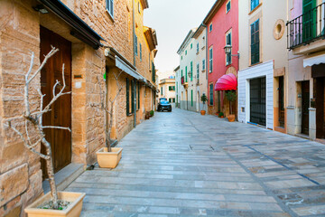 Sticker - Narrow street with residential houses . Spanish pedestrian street with showcases and homes  