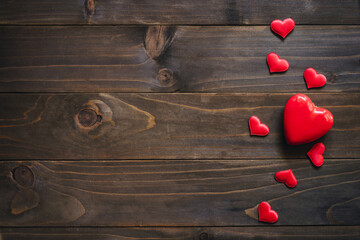 Wall Mural - Red heart on wooden background, valentine background with copy space.