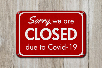 Wall Mural - Closed due to Covid-19 hanging red sign for your business