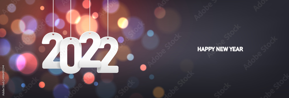 Happy new year 2022. Hanging white paper number on a horizontal colorful blurry background.
 - obrazy, fototapety, plakaty 