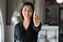 Close Up Smiling Indian Young Businesswoman Showing Thumbs Up At Camera, Standing In Modern Office, Happy Entrepreneur Employee Excited By Good Job, Career, Satisfied Client Recommending Service