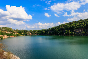 View of the lake at abandoned quarry on summer