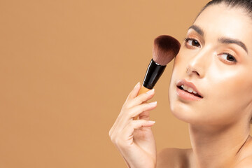 Beauty asian woman hold make up brush  and cheerful with make up brush