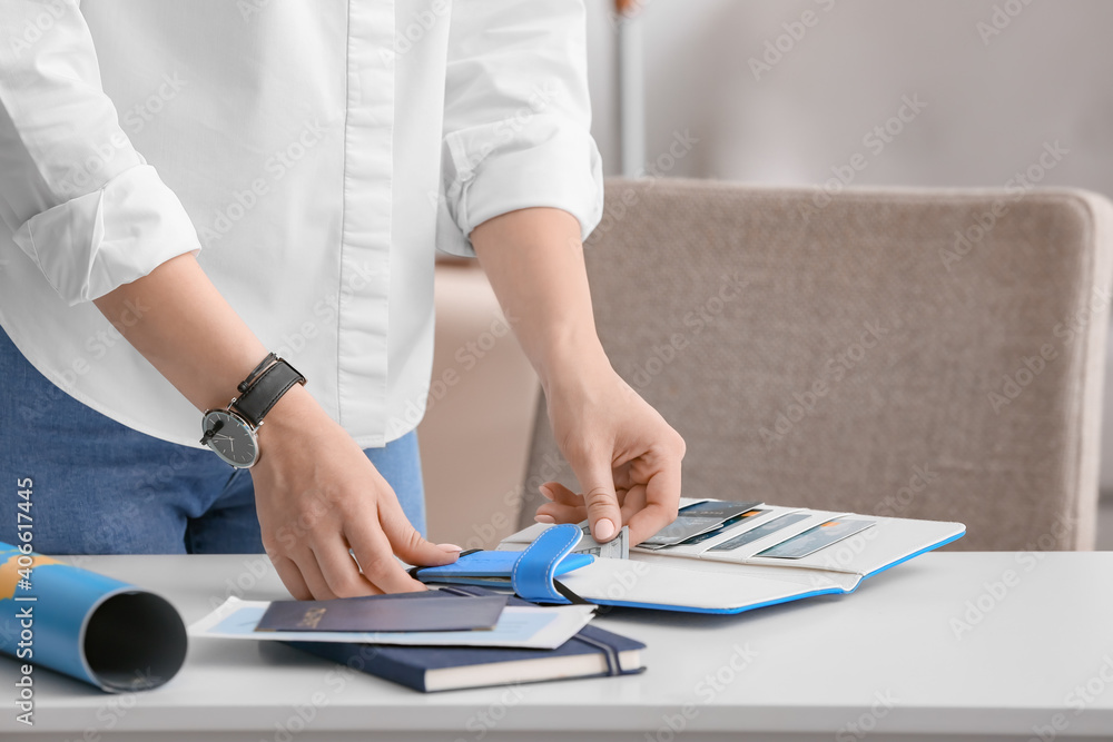 Woman with travel organizer at table