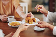 © DragonImages - Hands of senior women eating delicious traditional moon cake when celebrating mid autumn festival at home