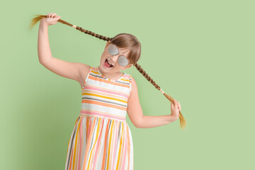 Sticker - Happy little girl wearing stylish sunglasses against color background