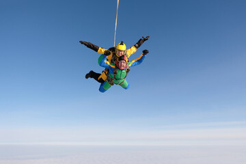 Skydiving. Tandem jump. Two guys are flying in the sky.