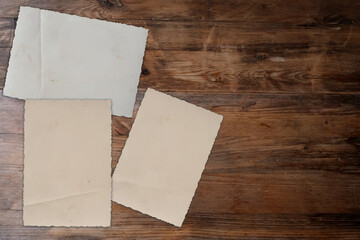 empty mock up background of old wood, set of vintage photos with blank, back side of the photo, concept family genealogy, memories, generational ties, museum historical materials