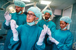 © NDABCREATIVITY - Portrait of a successful medical surgeon team inside operating room