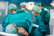 © NDABCREATIVITY - Group of surgeon team at work in operating room in hospital