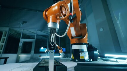 Wall Mural - microcircuits are being put together by a robotic arm