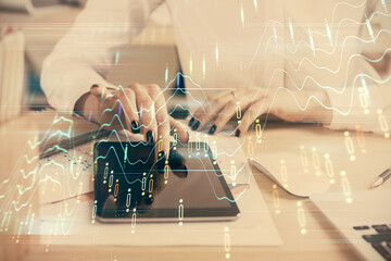 Double exposure of forex chart sketch hologram and woman holding and using a mobile device. Financial market concept.