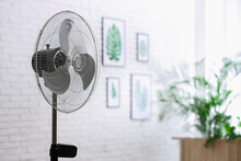 Modern Electric Fan In Room. Space For Text