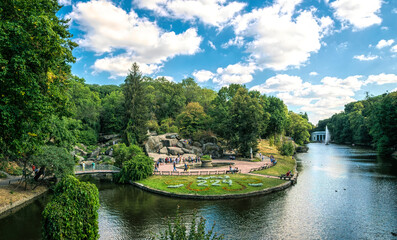 Poster - Colorful traditional English garden and flowering flower beds. Arboretum Sofievka in the city of Uman, Ukraine