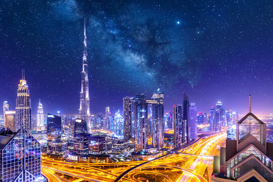 Wall Mural -  - Amazing skyline cityscape with illuminated skyscrapers. Downtown of Dubai at night with stars and milky way, United Arab Emirates.