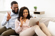 © Prostock-studio - Black couple having videocall using tablet waving hands