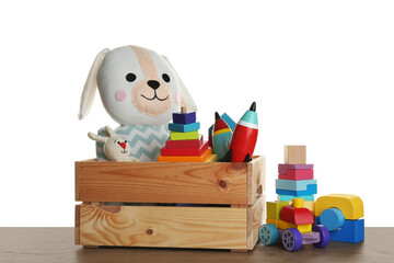 Wall Mural - Set of different toys on wooden table against white background