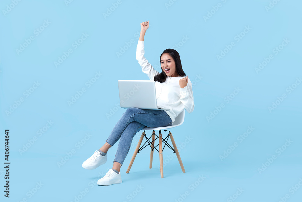 Young woman asian happy smiling celebrate. While her using laptop ...