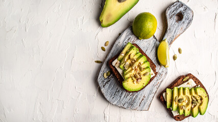 Canvas Print - sandwiches with avocado, cheese, pumpkin, nut and sesame. banner, catering menu recipe place for text, top view