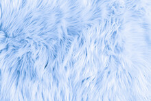 Light Blue Long Fiber Soft Fur. Blue Fur For Background Or Texture. Fuzzy Blue Fur Plaid. Shaggy Blanket Background. Fluffy Fake Textile Fur. Flat Lay, Top View, Copy Space